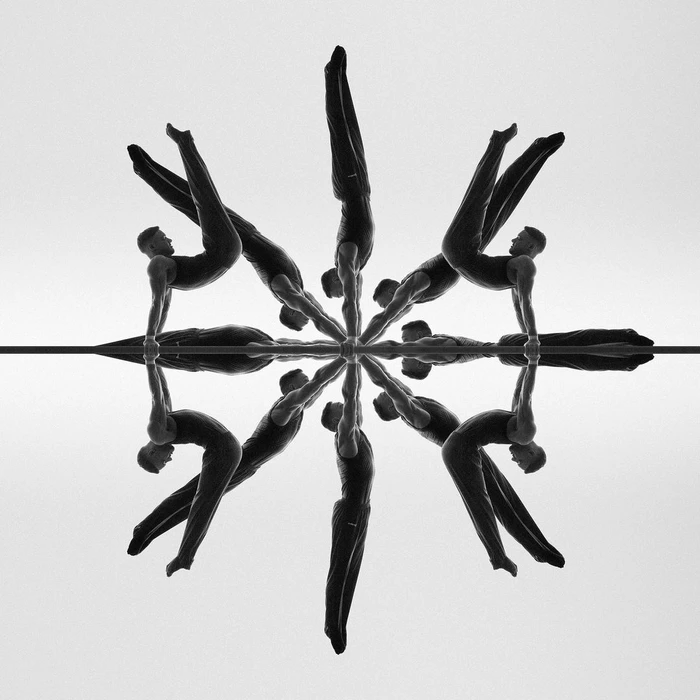 Symmetrical kaleidoscopic black and white photographic composition by Sandro Baebler featuring gymnasts