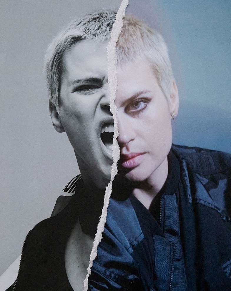Torn photo with a woman in a jacket, half her face showing an angry expression and half her face showing a neutral expression.