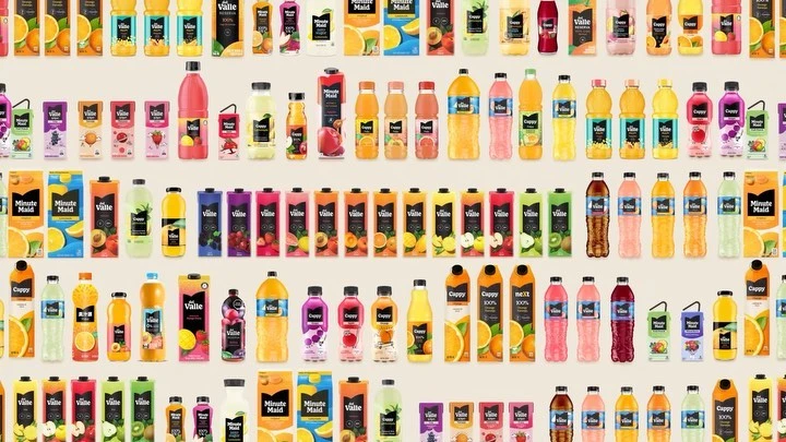 Multiple rows of bottled and boxed fruit juices from brands like Minute Maid, Del Valle, and Cappy, in many flavors and colors.