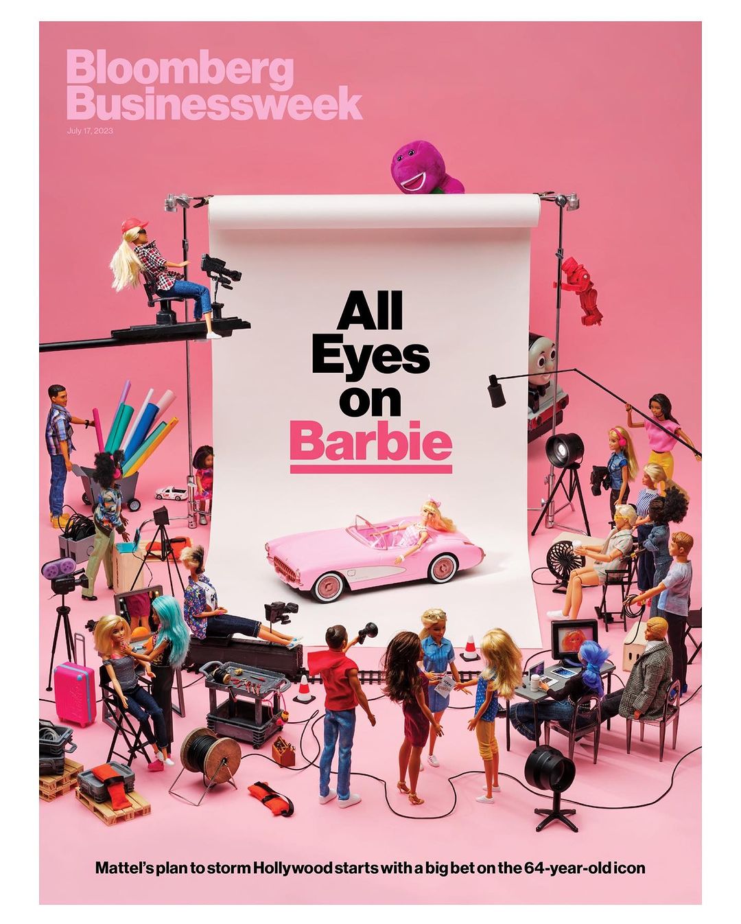 Bloomberg Businessweek cover featuring Barbie and a miniature film set, including a pink Barbie car, various film props, and doll actors.