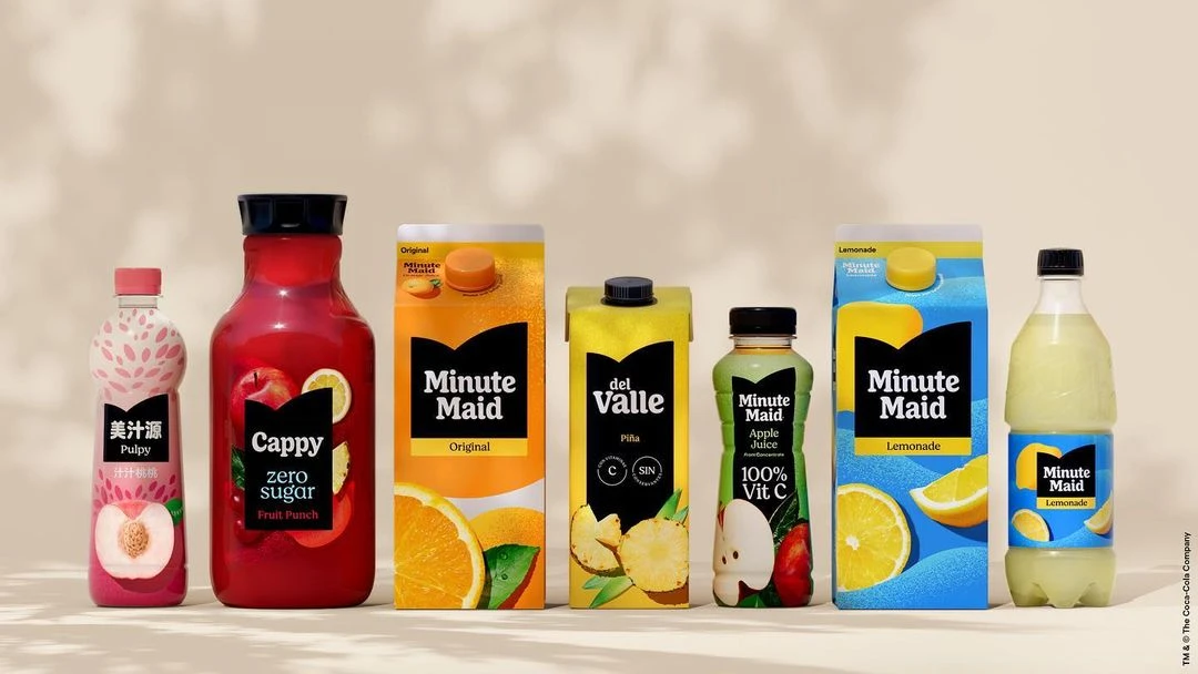 Assortment of Minute Maid and Cappy brand fruit juice beverages in bottles and cartons, lined up against a neutral background.