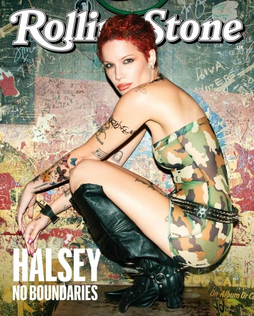 Halsey poses on the cover of Rolling Stone magazine wearing a camouflage-patterned outfit and black boots in front of graffiti background.