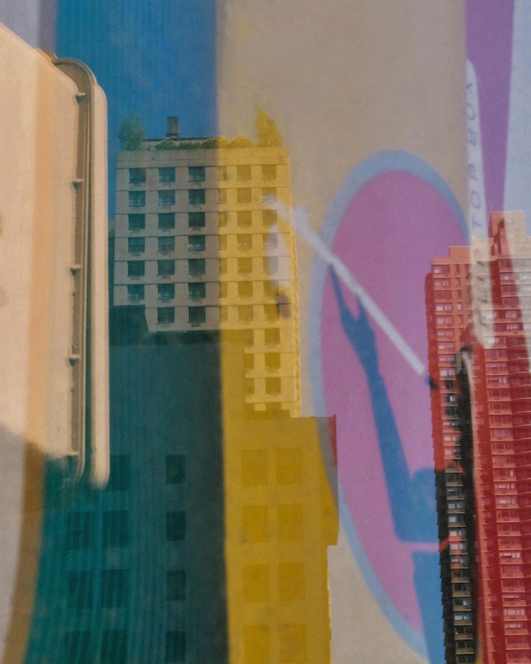 Colorful abstract collage with layered cityscapes in blue, yellow, and red, featuring geometric shapes and textured surfaces. 