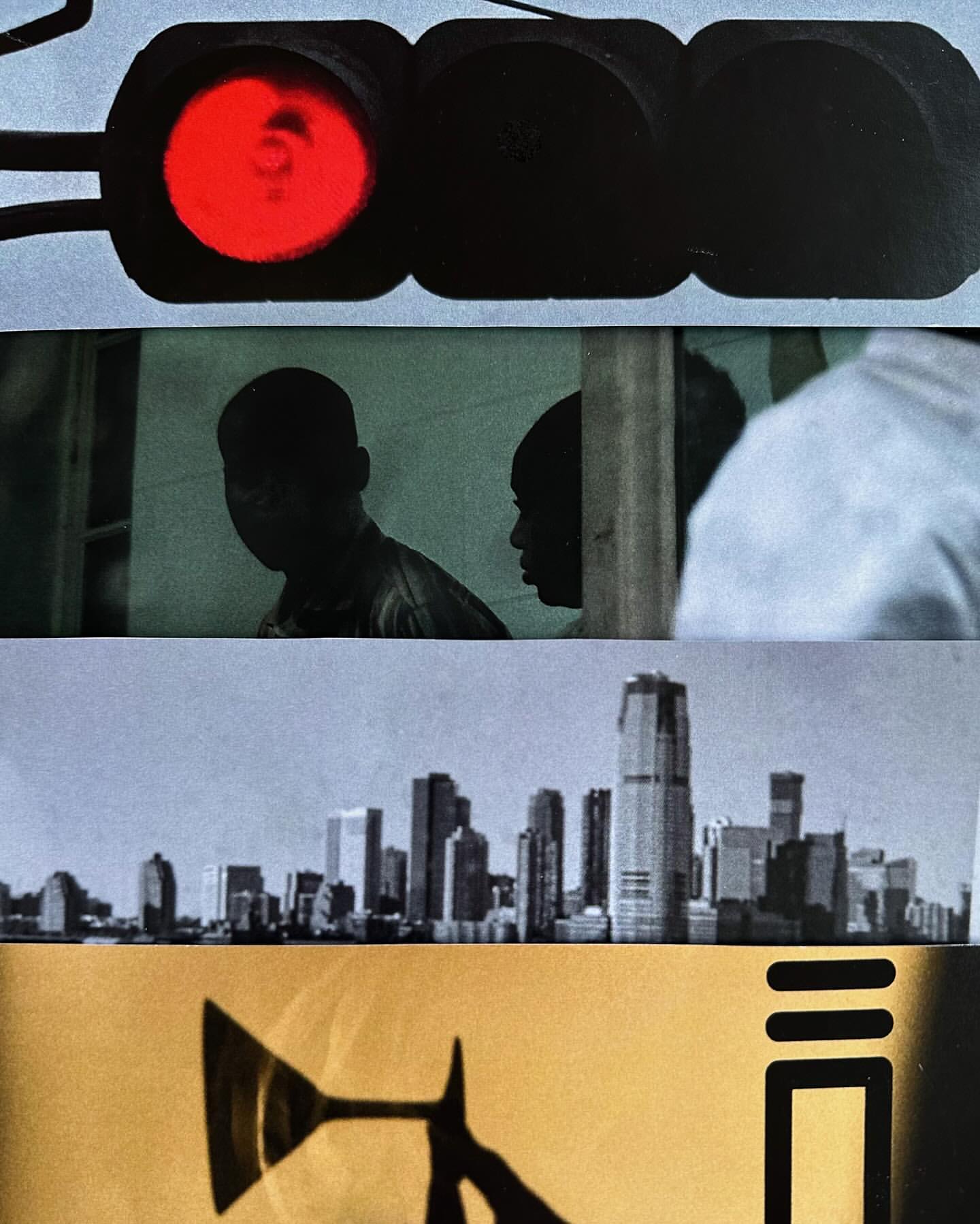 Abstract image features a traffic light, two silhouetted people, a city skyline, and a silhouette of an object against a tan background.