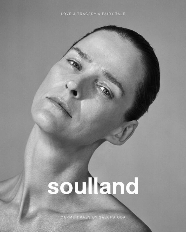 Black and white portrait of a woman with an elegant pose, set against a neutral backdrop, with the text "soulland" visible.