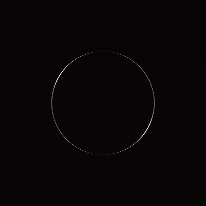 Abstract black background with a silver circle in the center, creating a simple yet elegant and modern visual composition.