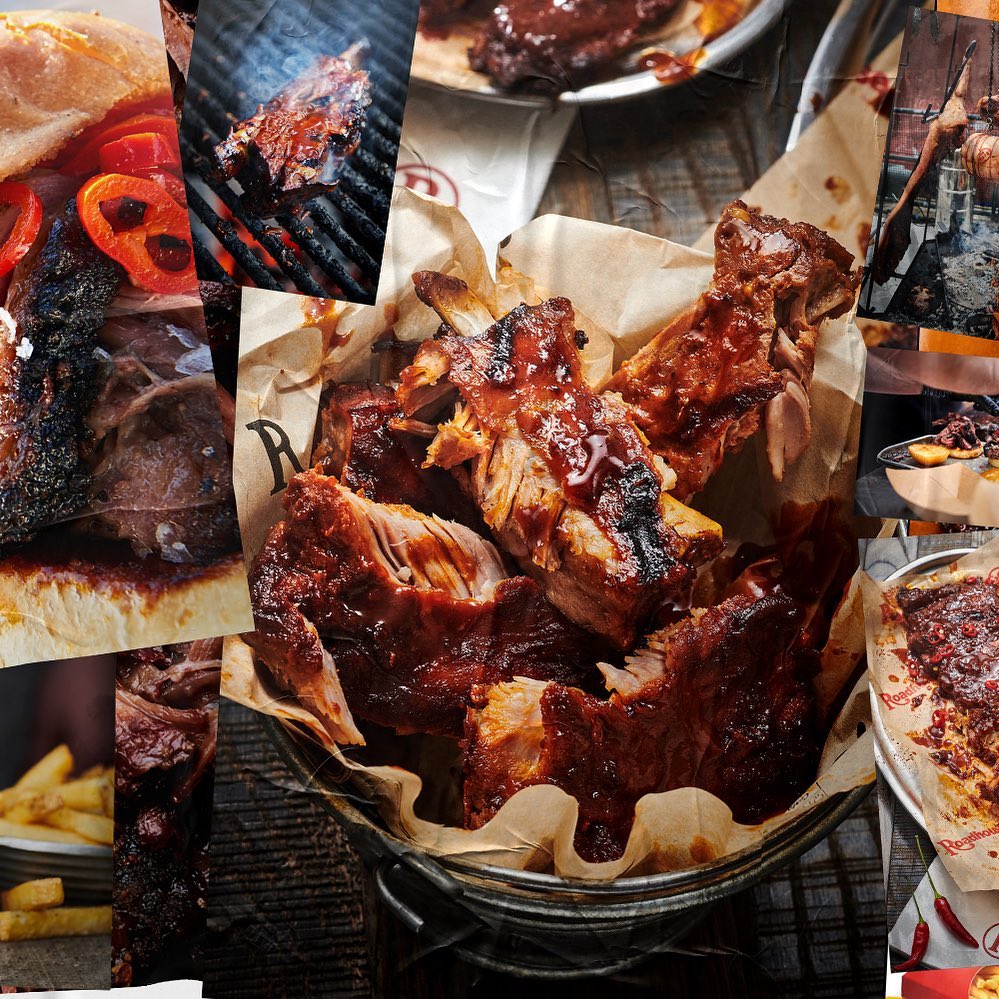Barbecue ribs and a pulled pork sandwich on a wooden table, creating an appetizing and rustic food spread. BBQ style, dark food photography.