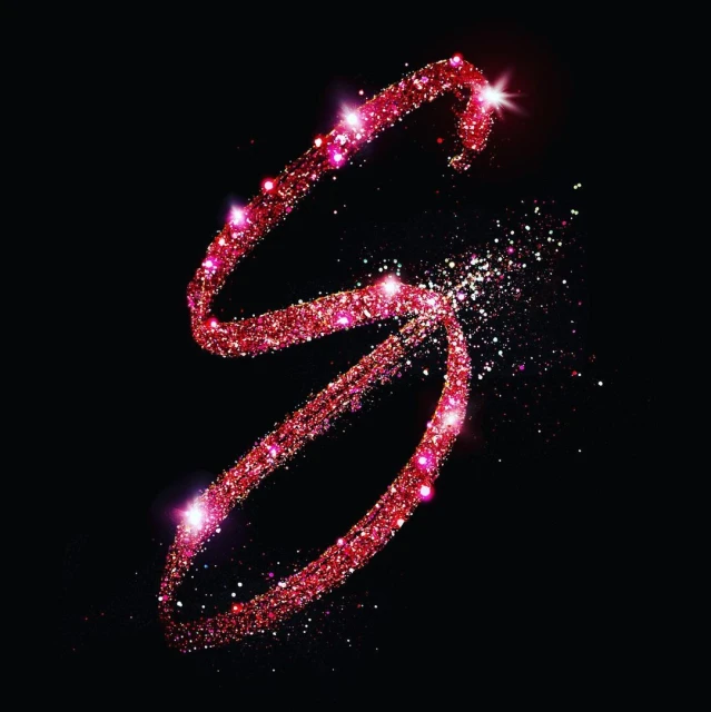 Sparkling red glitter forms the letter S against a black background, creating a visually striking and elegant design element.