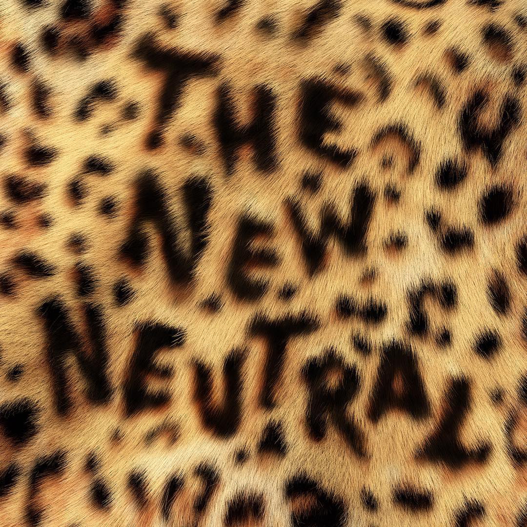 Text overlay on a leopard-print background reads, 'The New Neutral.' The background has a tan color with dark brown spots.