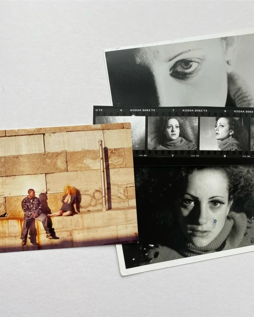 Collage of color and black and white photographs featuring portraits, a couple sitting on a wall, and film strips on a white background.