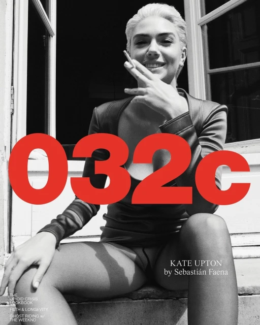 Black and white portrait of a woman with short hair wearing a black top, smoking a cigarette, with red text overlay on a magazine cover.
