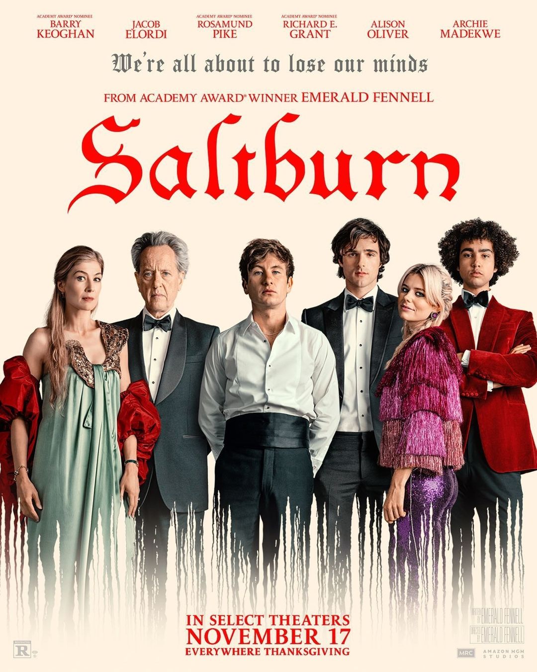 Movie poster for 'Saltburn' features seven actors including Rosamund Pike and Jacob Elordi standing indoors in formal wear against a cream backdrop.