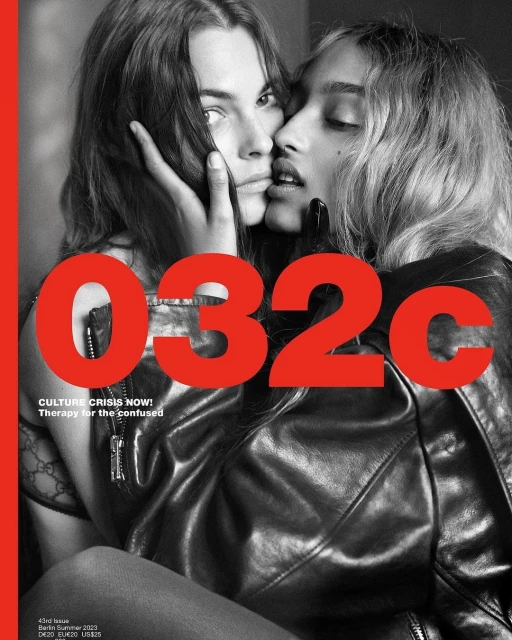 Magazine cover featuring two women in close contact, one resting her hand on the other's face, with '032c' in large red text.