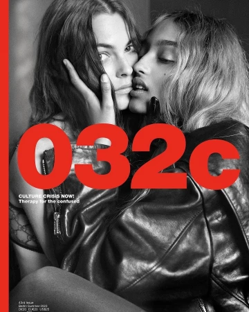 Magazine cover featuring two women in close contact, one resting her hand on the other's face, with '032c' in large red text.