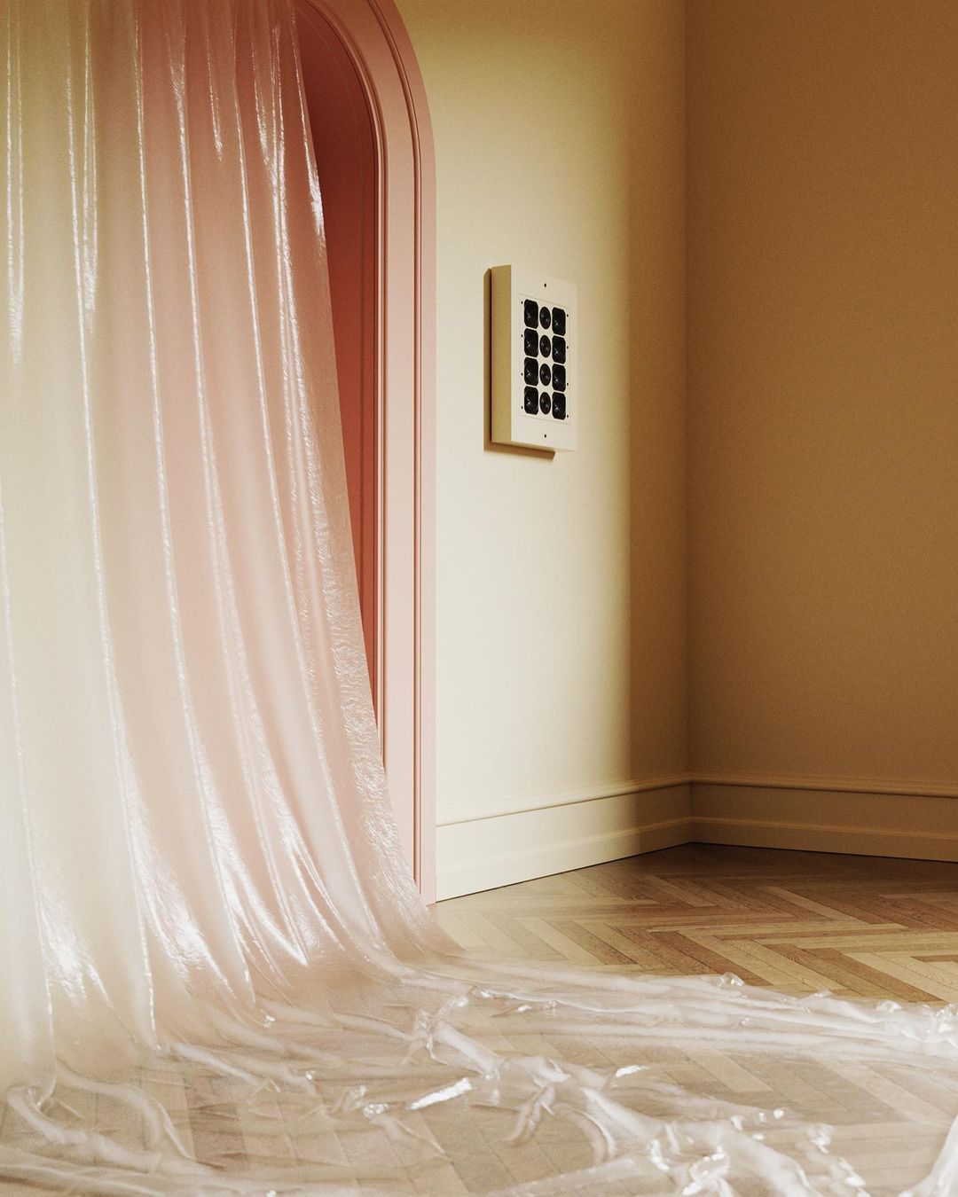 Abstract interior space with sheer, light pink fabric draped over a doorway and pooled on a chevron-patterned wooden floor.