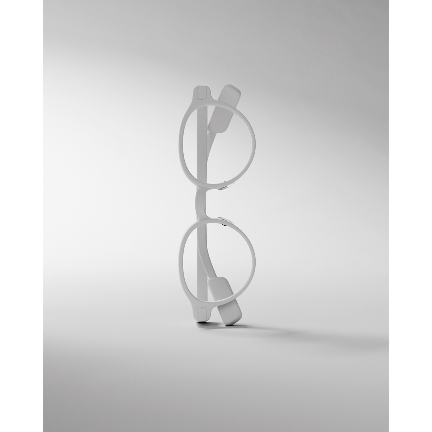 Pair of minimalist, all-white eyeglasses standing upright, casting a soft shadow on a gradient white background. Product shot.