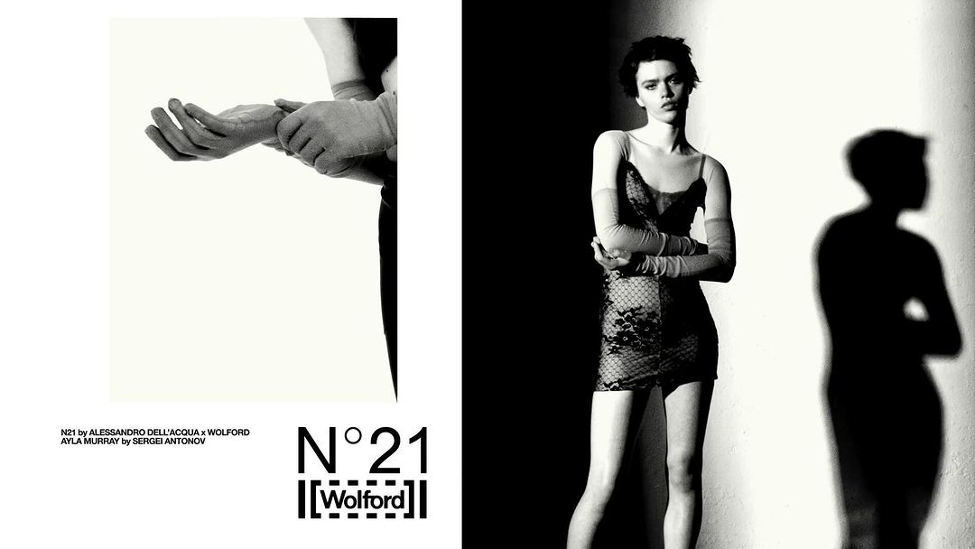 Monochrome studio fashion shot featuring a model in a patterned dress with long gloves, plus a shadow and partial view of hands.