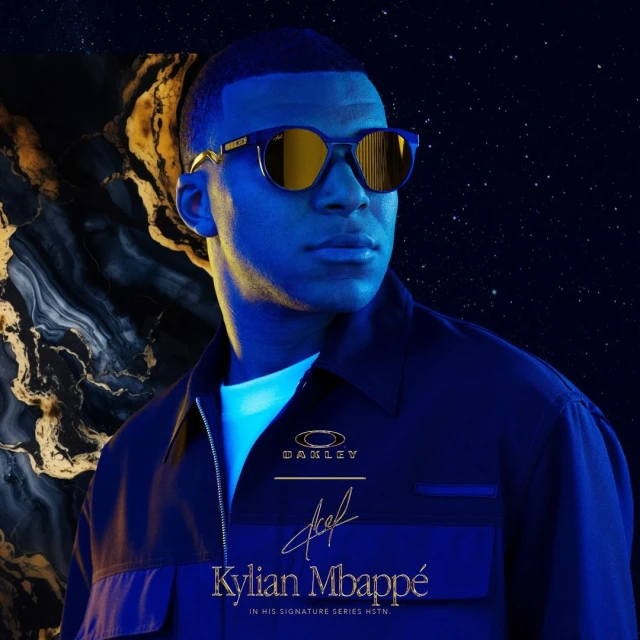 Kylian Mbappé wearing Oakley sunglasses in a promotional shot with blue lighting, marble, and a starscape background.
