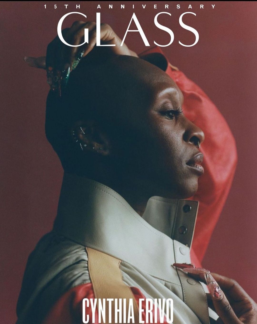 Cynthia Erivo, a Black woman, poses in a studio portrait wearing a white collar and a colorful garment, a magazine cover with bold text.