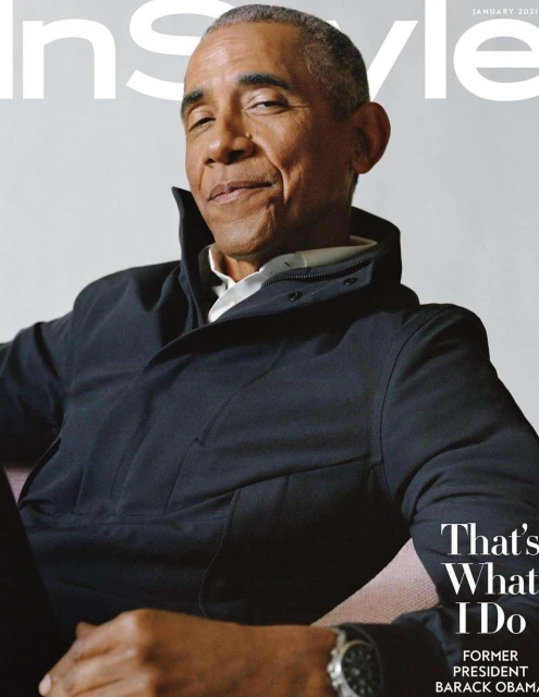 Magazine cover featuring former President Barack Obama in a dark jacket, seated indoors, showcasing a confident pose and a wristwatch.
