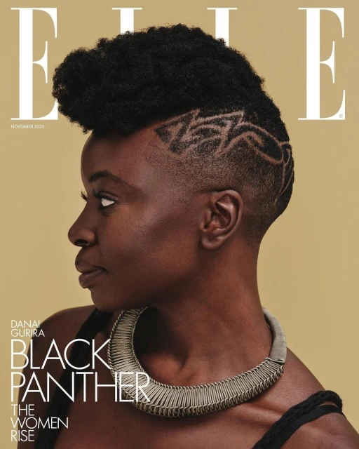 Elle magazine cover featuring Danai Gurira with an afro and statement necklace on a tan background. November 2022 issue.