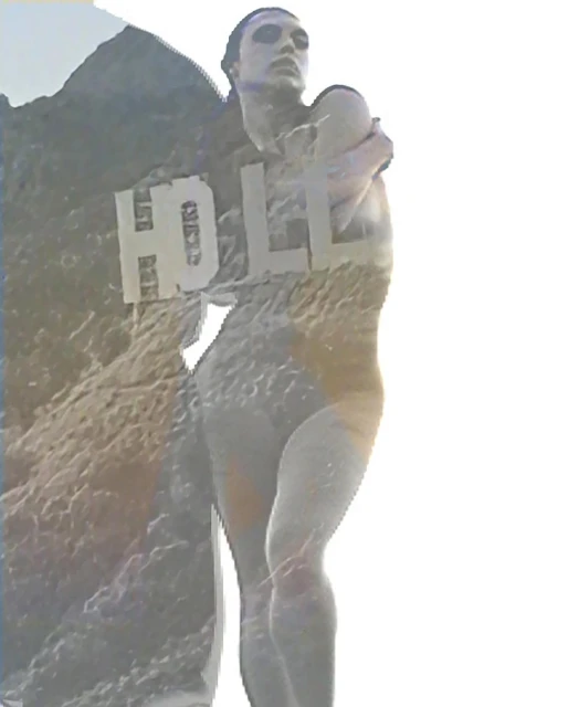 Adult female model with transparent double exposure of Hollywood mountain. Studio shot with cool colors and muted tones creates fine art.