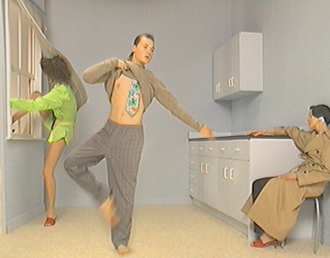Three figures in an off-kilter domestic scene. One is dancing, another looks out the window, and a third sits talking on a phone.