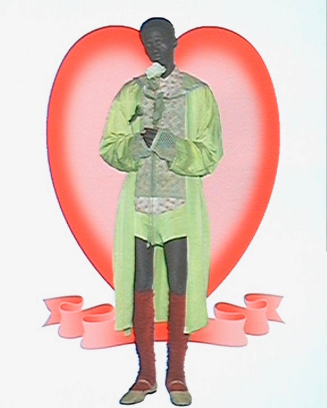 A person in costume holding a white rose, standing against a heart-shaped backdrop with a ribbon. The colors are light and soft.