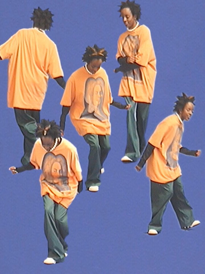 Multiple images of a Black woman dancing in an orange t-shirt and green pants against a blue background, capturing movement and style.