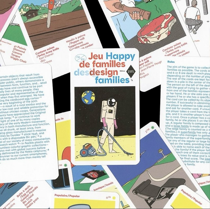 Close-up of 'Jeu Happy des design families' game card featuring an astronaut vacuuming on the moon, surrounded by other cards.