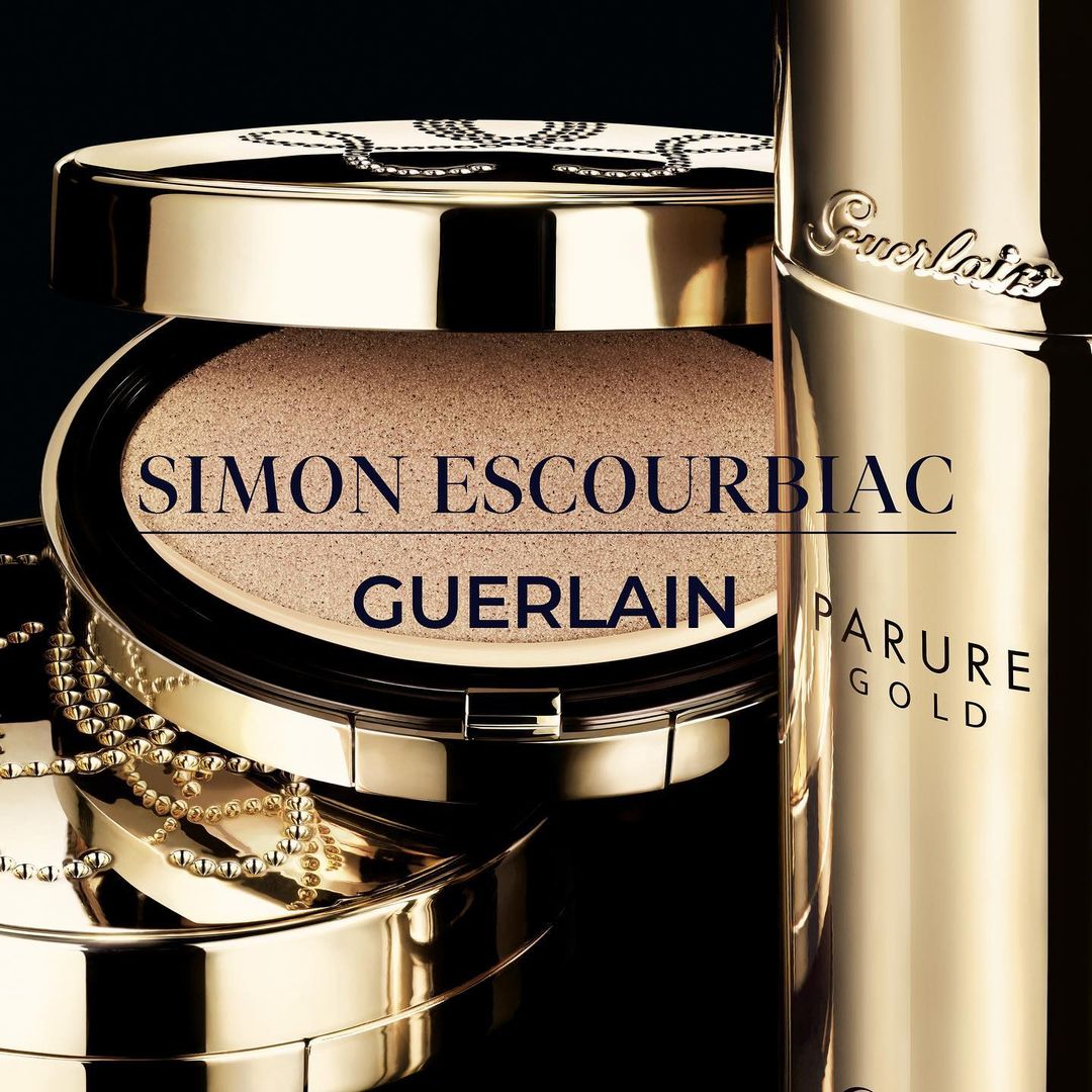Guerlain Parure Gold foundation product shot with gold packaging, featuring the brand's iconic design elements, against a dark backdrop.