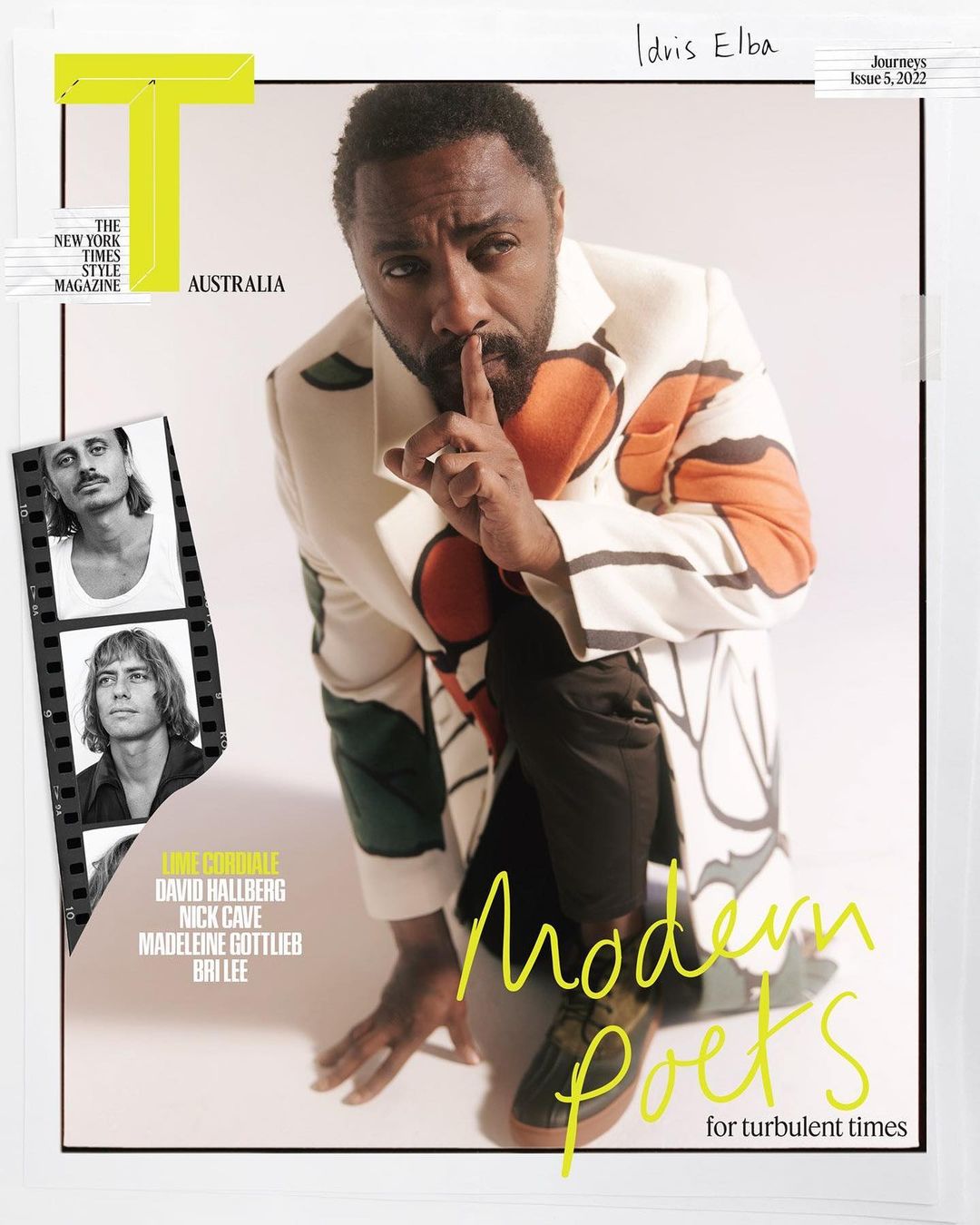 Magazine cover featuring Idris Elba in a patterned jacket with finger to lips, alongside inset images and text elements against a white backdrop.