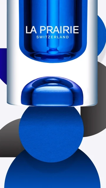 Product shot of La Prairie skincare product with blue and white packaging and geometric circular designs on a white background.