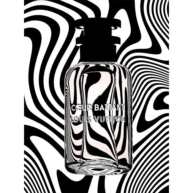 Louis Vuitton perfume bottle stands out against a black and white optical art background in a beauty and fashion studio shot.