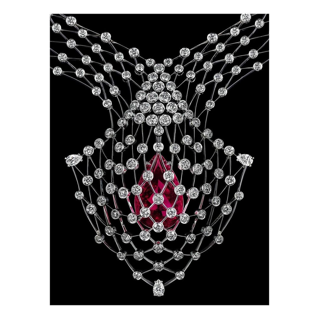 Necklace with white diamonds and large red gemstone in abstract pattern on a black background. Jewelry fashion advertising photo.