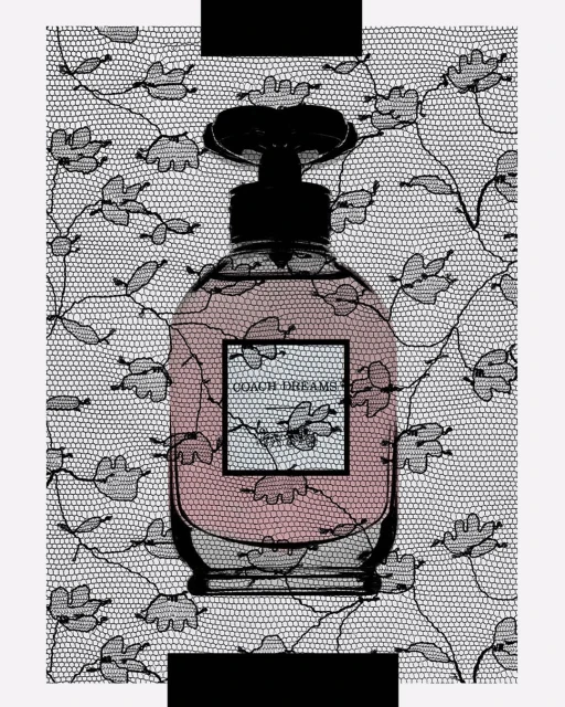 Coach Dreams perfume bottle on a white background with black lace. The pink liquid of the perfume is visible through the glass.