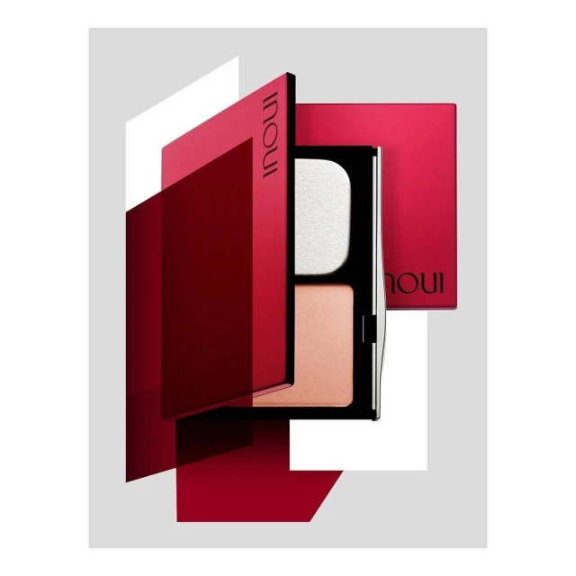 INOUi cosmetic powder palette. Red and white rectangles frame the black cosmetic palette. Makeup powder and sponge applicator are visible.