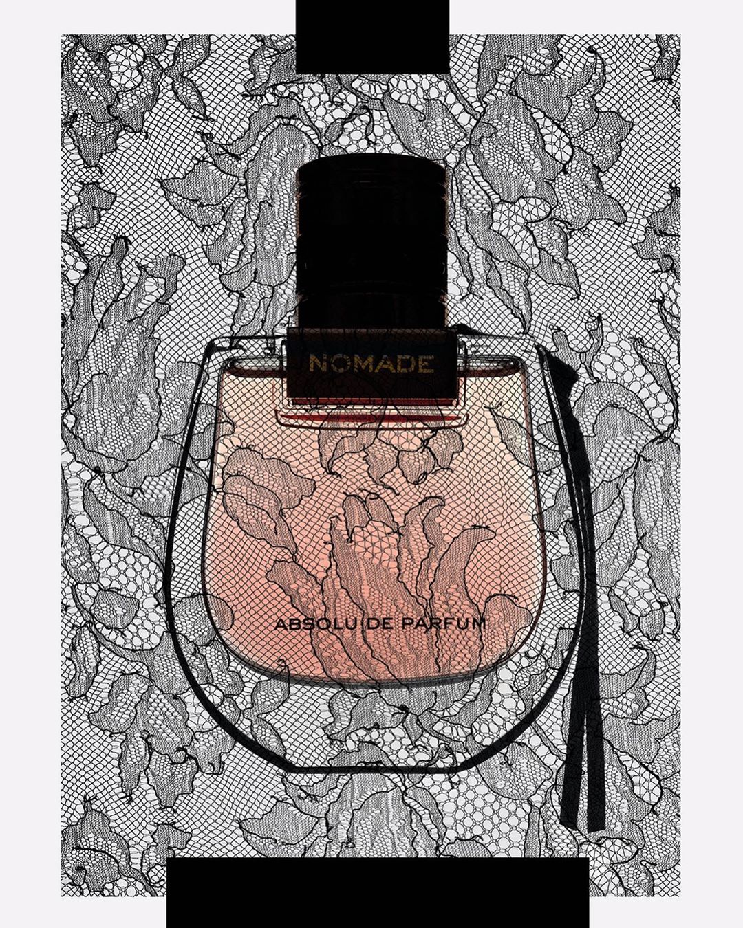 Close-up of Nomade Absolu de Parfum bottle with a black stopper, featuring intricate black floral lace patterns in the background.