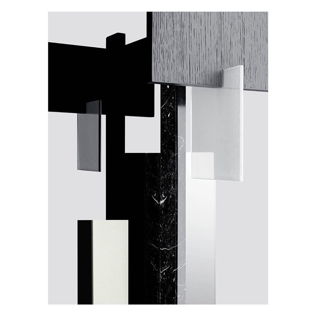 Abstract geometric composition featuring black, white, and gray rectangles and a marble column against a neutral background.