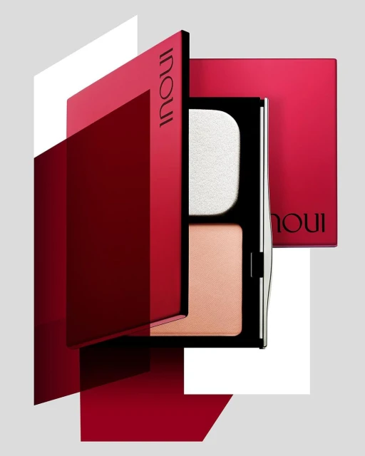INOUI makeup compacts in red and black packaging, including powder and sponge, set against a gray background with geometric overlays.