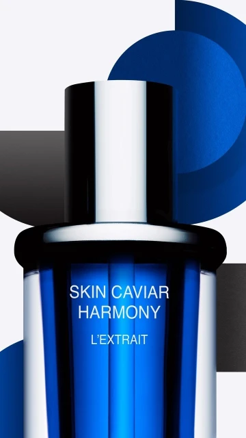 Close-up of a skin care serum bottle with silver cap and blue liquid, featuring geometric shapes in black, white, and blue.