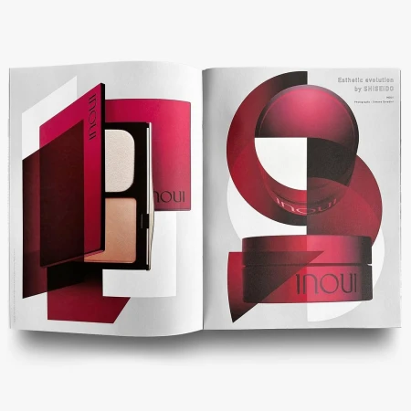 Open magazine spread featuring product shots of INOUI by SHISEIDO makeup, red and white geometric designs on a white background.