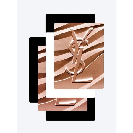 Close-up product shot of Yves Saint Laurent bronzer compact with embossed YSL logo against layered black and white panels.