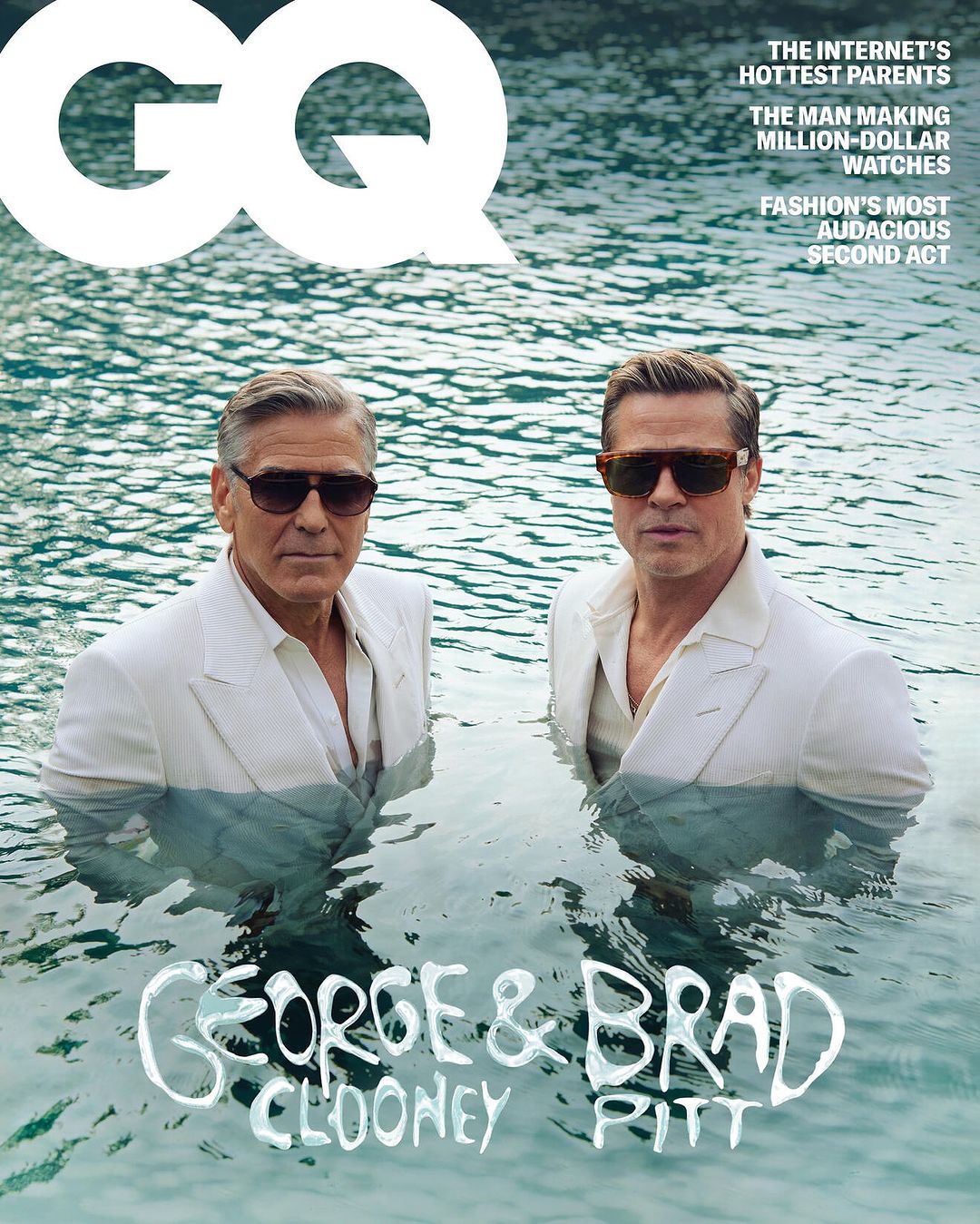 GQ Magazine cover featuring George Clooney and Brad Pitt in water wearing suits and sunglasses for a celebrity and entertainment themed photoshoot.