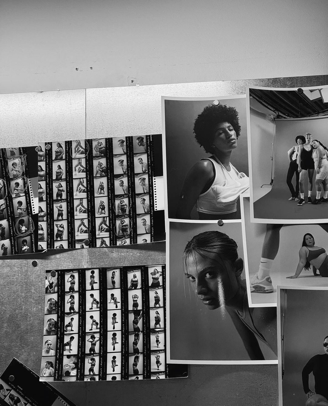 Studio pin board with athletic women's photography: headshots, full-body poses, and contact sheets in black and white.