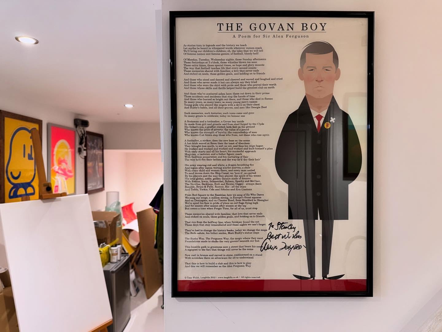 Framed illustration of Alex Ferguson, the legendary football manager, hangs on a wall with colorful abstract art in the background.