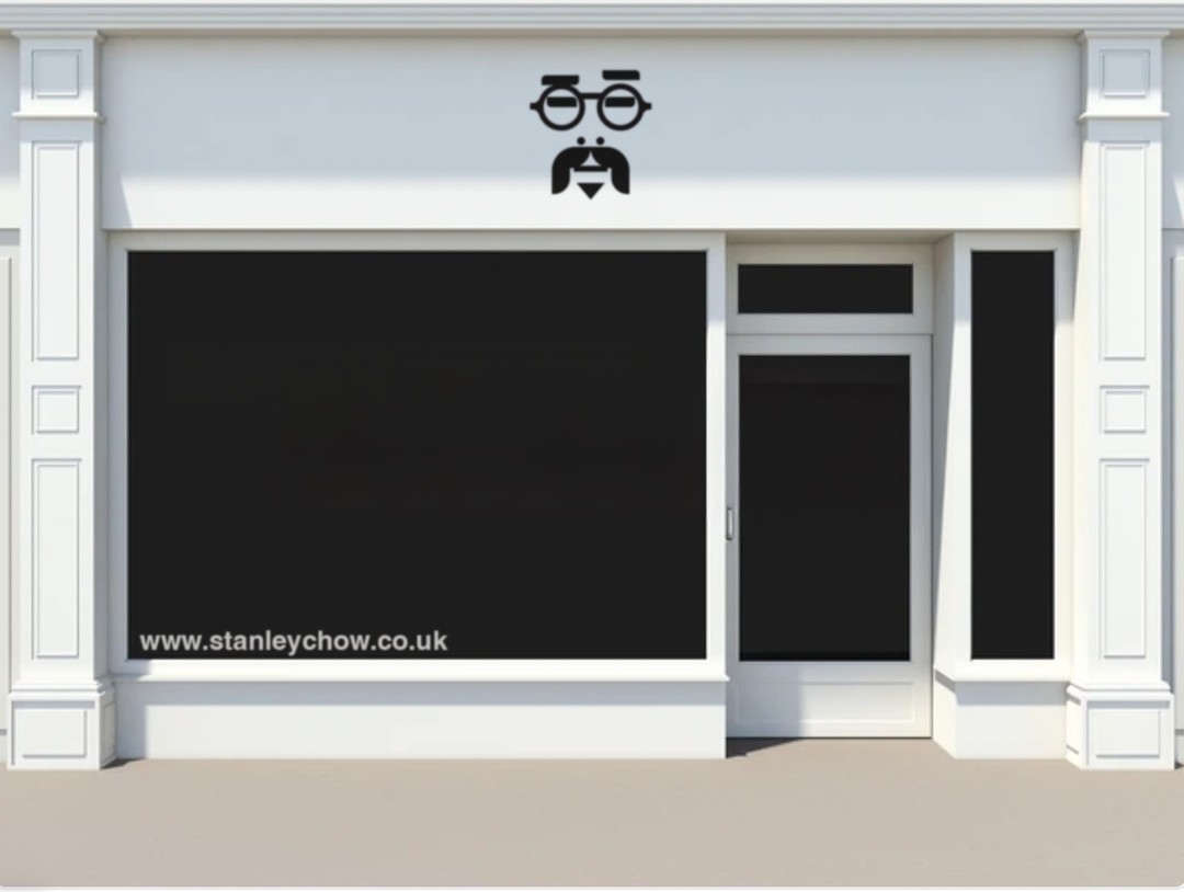 Storefront facade with a blacked-out window, adorned with a stylized mustache and glasses logo above, and website address below.