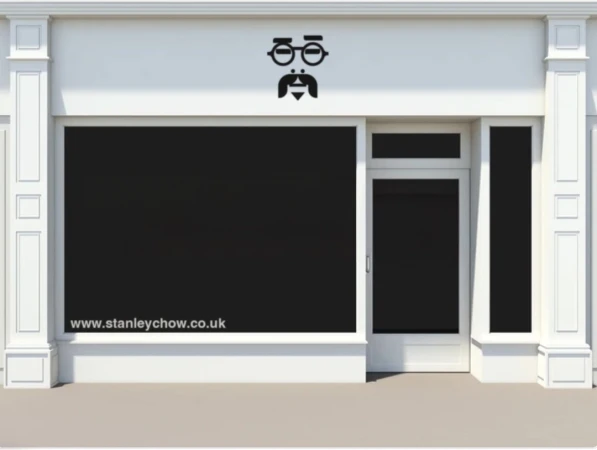 Storefront facade with a blacked-out window, adorned with a stylized mustache and glasses logo above, and website address below.