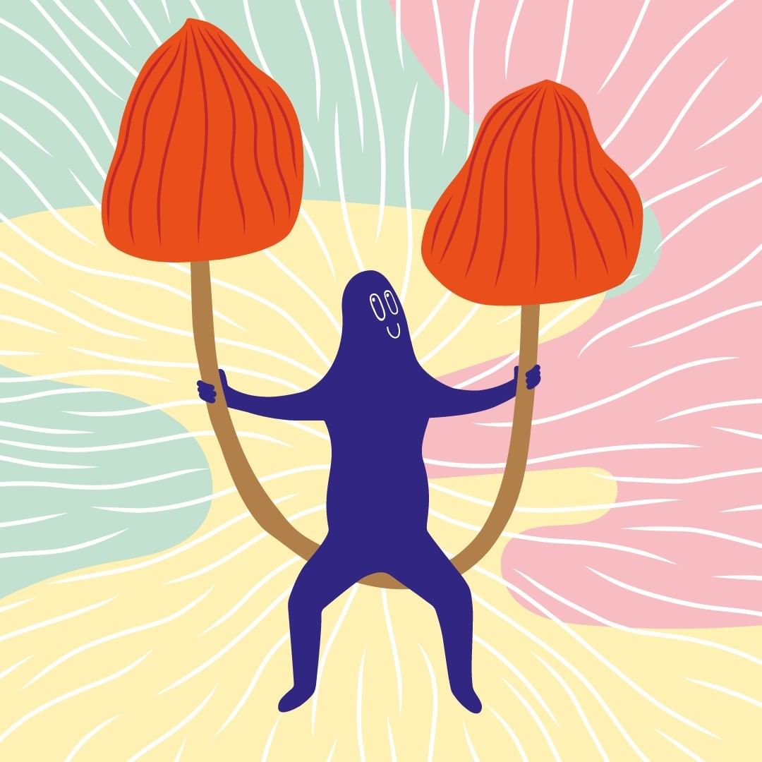 Illustration of a blue cartoon figure with a smiling face holding two orange mushrooms against a patterned background.