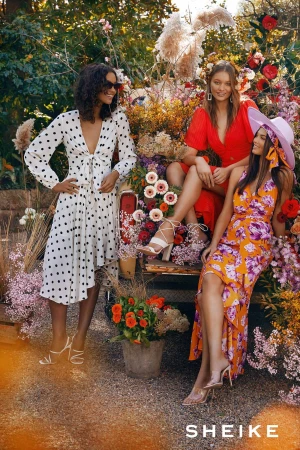 Three female models posing among colorful flowers and foliage, styled by Charlotte Stokes in Sydney.
